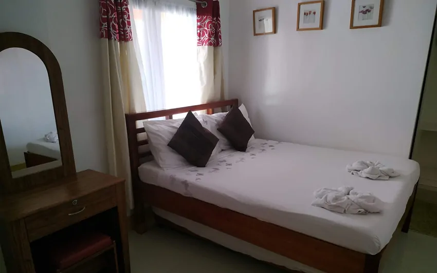 Standard Room bed - Palm Grove Saud Holiday complex Pagupud